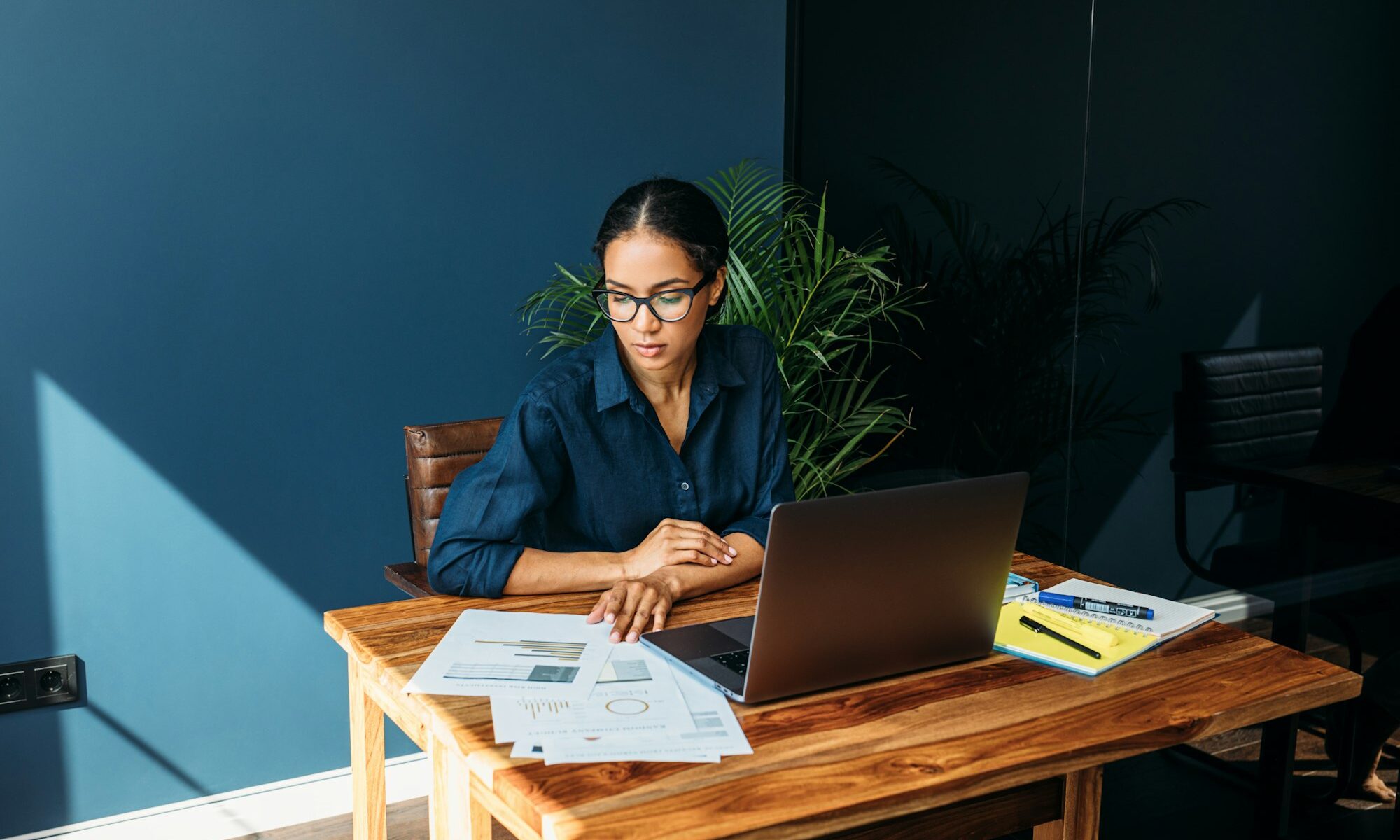 Young woman working with documents from home