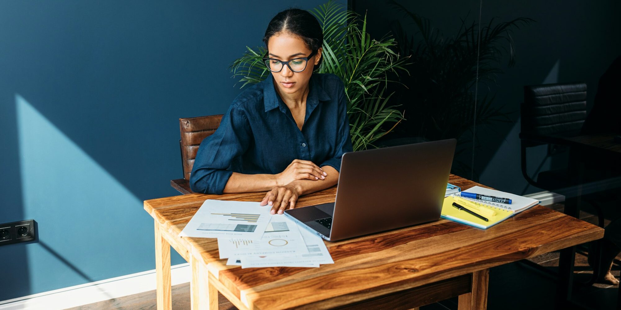 Young woman working with documents from home